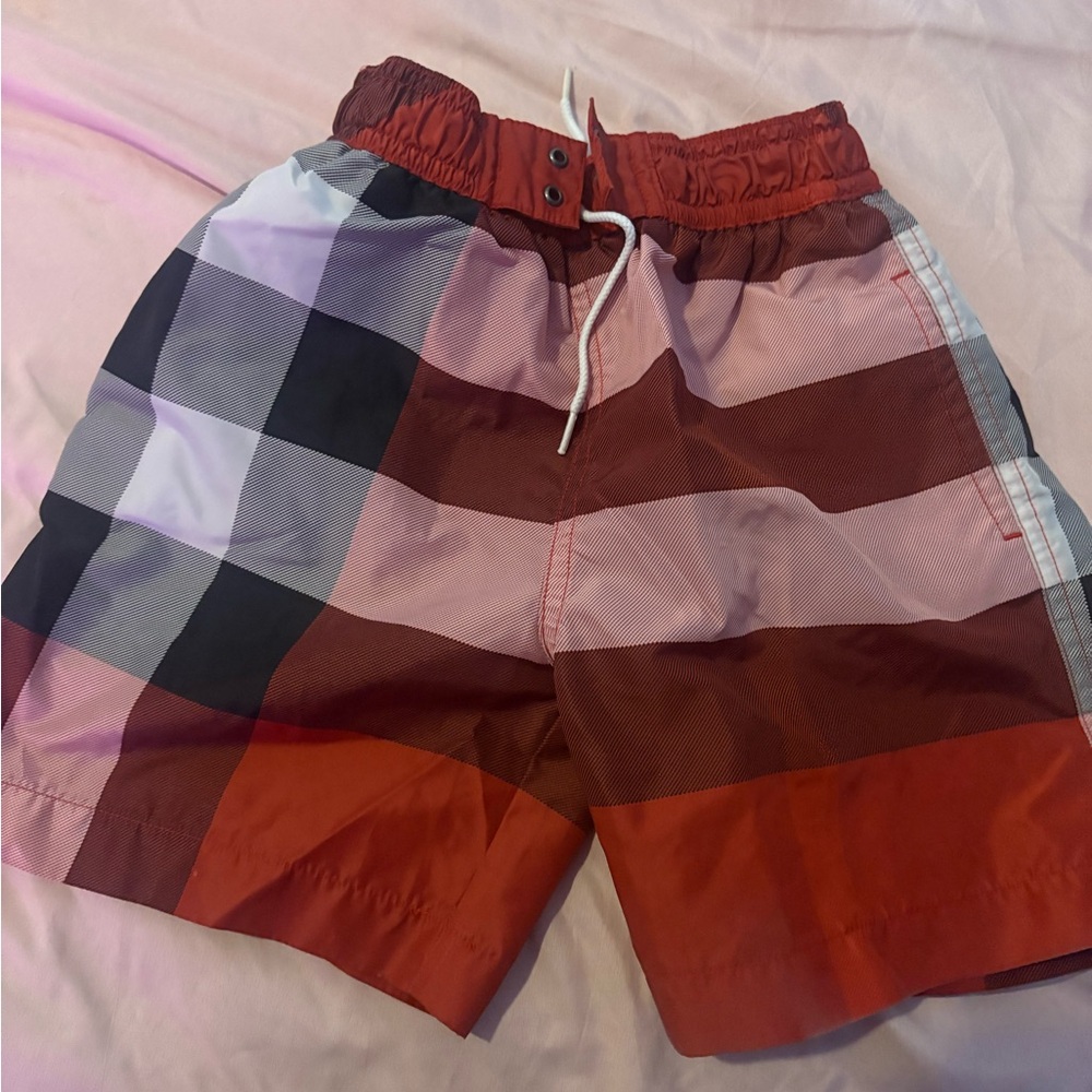 Burberry Red and Black Swim Trunks with Classic Plaid Design